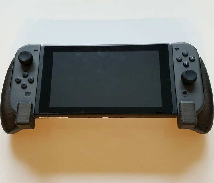 کنسول بازی نینتندو سوییچ کپی خور شده دارای رم و بازی روز طوسی Nintendo Switch با گارانتی 1ماهه سالم